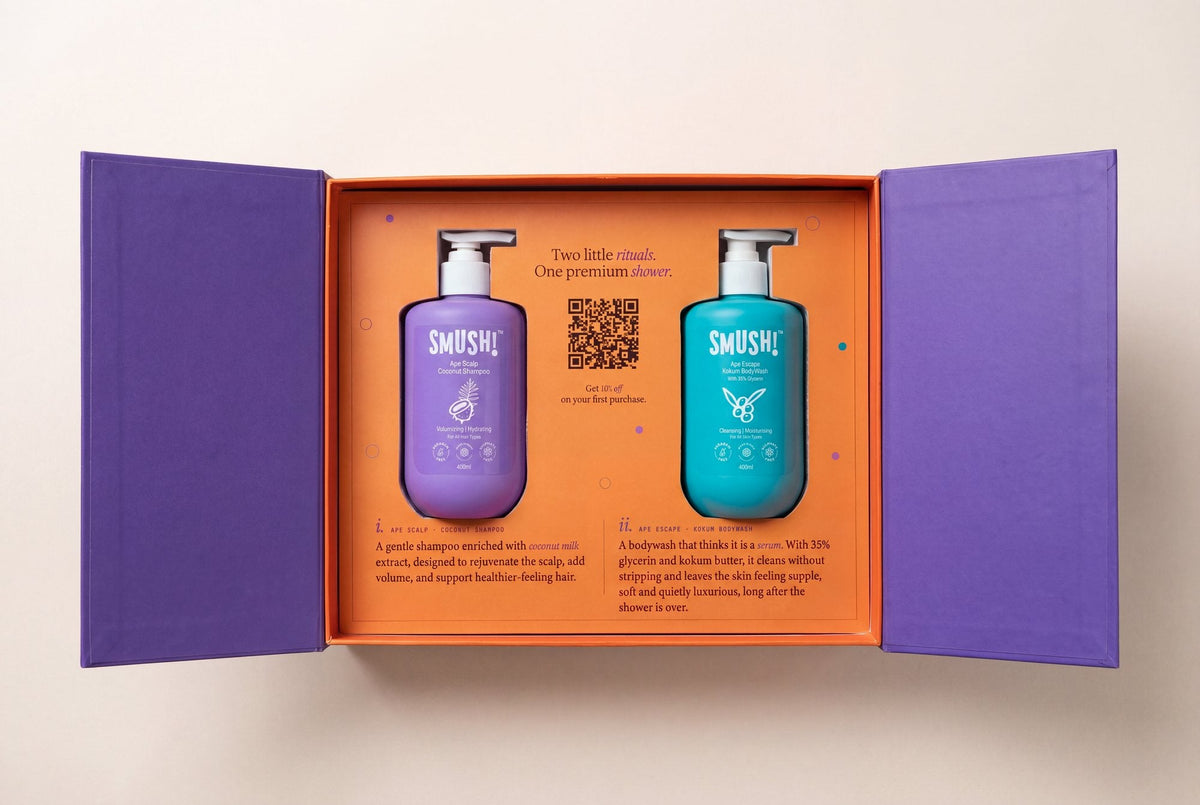 The SMUSH! gift box open, both magnetic doors swung out, with the Coconut Shampoo and Kokum Body Wash seated in the tray