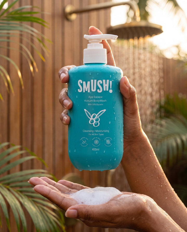 Ape Escape Kokum Body Wash held in an open-air shower, lather in the other hand