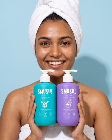 Woman in a towel turban holding the body wash and the shampoo
