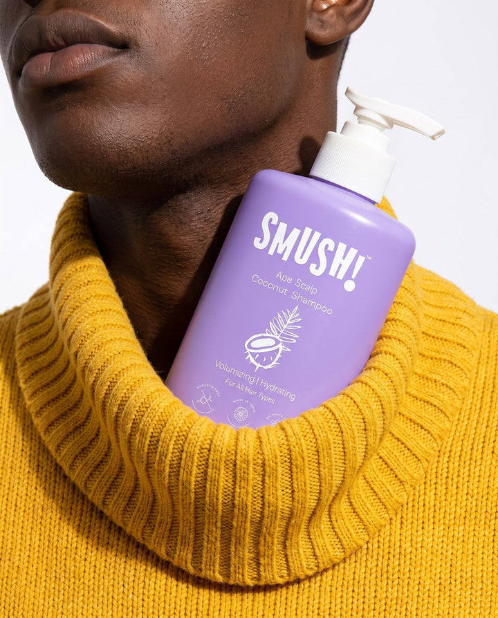 Ape Scalp Coconut Shampoo tucked into a yellow knit roll-neck
