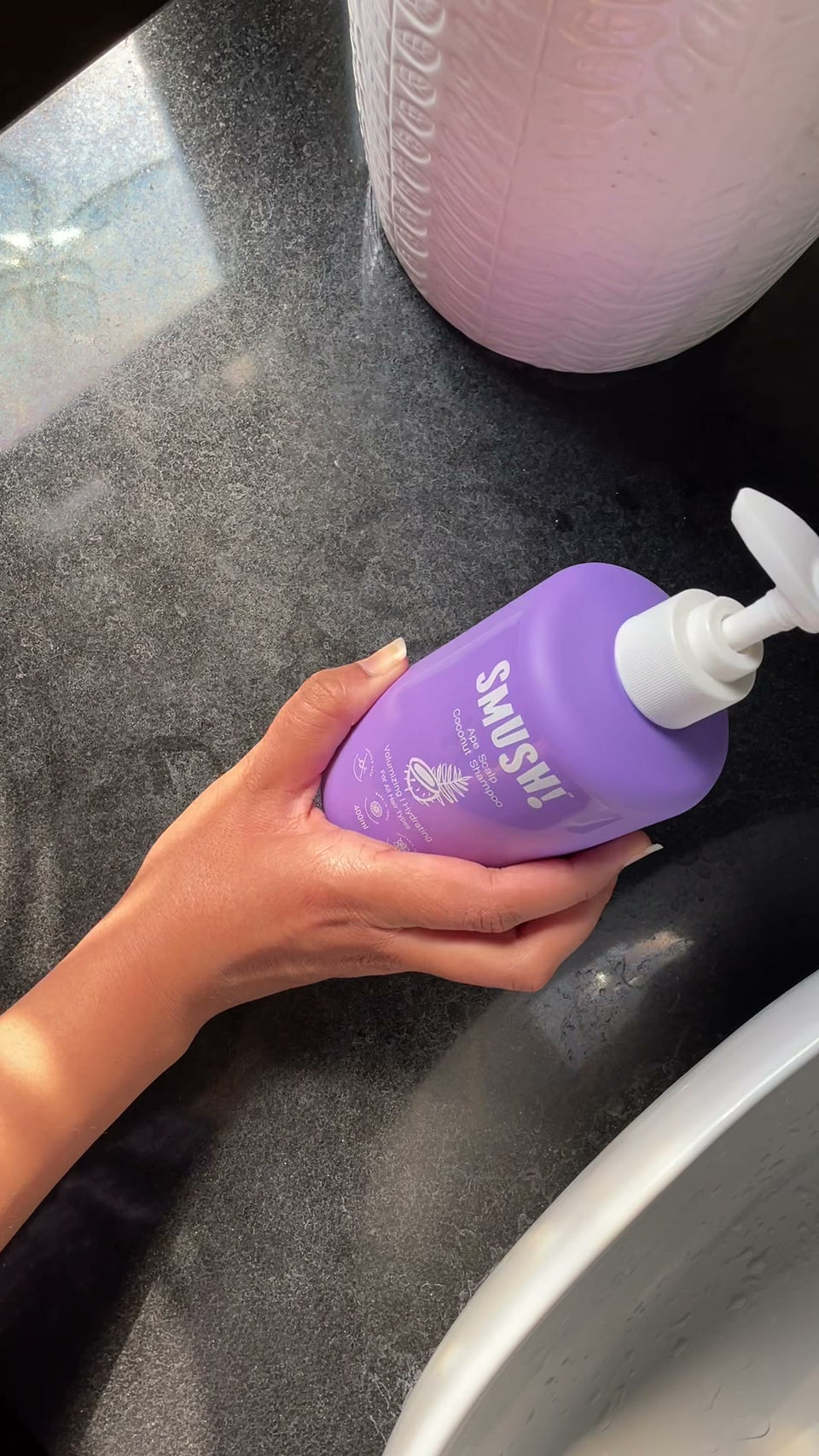 Pumping Ape Scalp Coconut Shampoo on a dark countertop