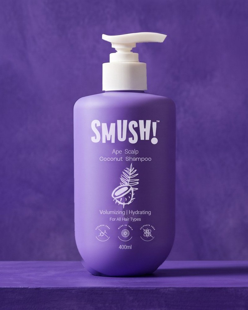 SMUSH! Ape Scalp Coconut Shampoo, the purple 400 ml pump bottle, on a violet limewash ledge